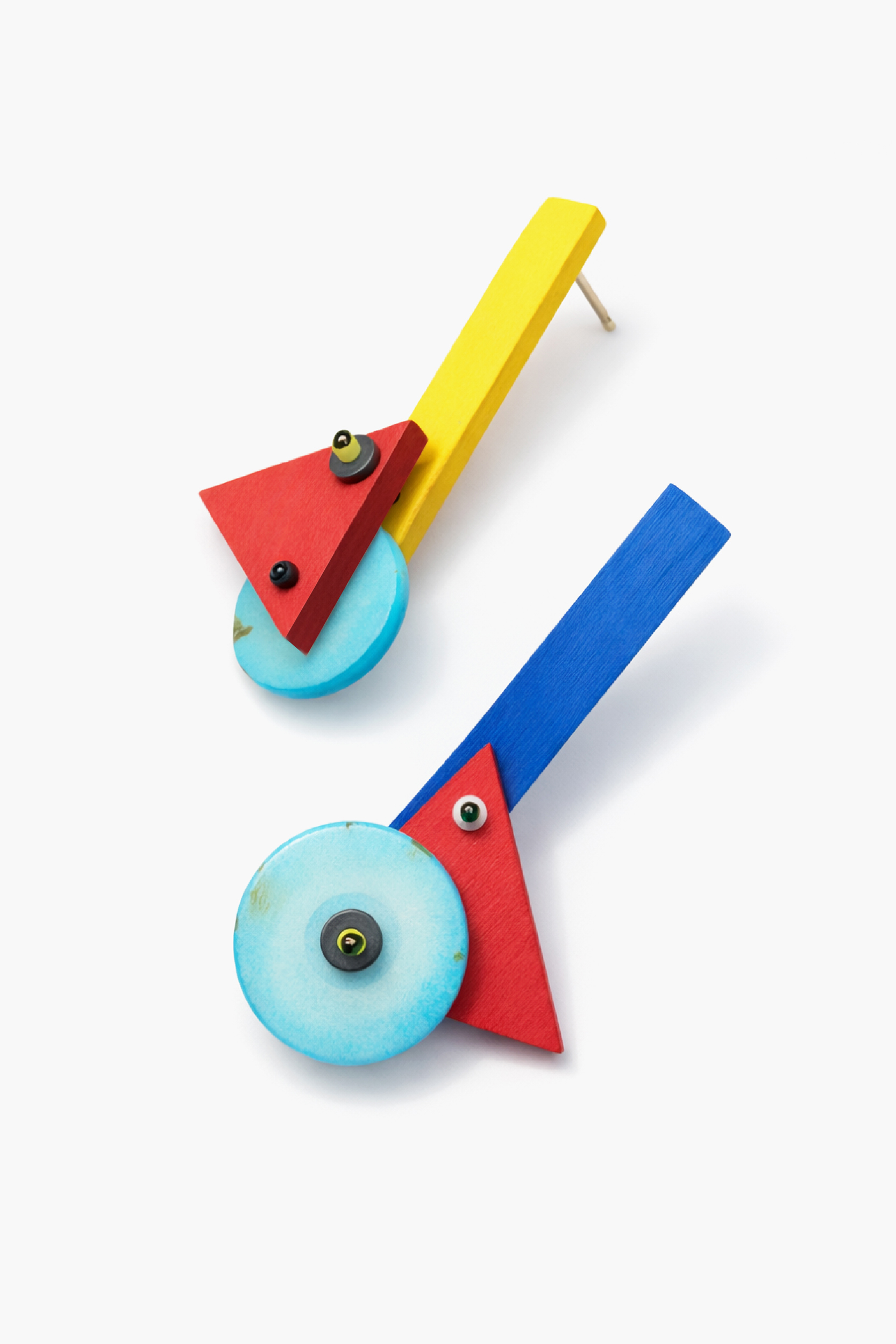 Abstract asymmetrical statement earrings handmade from wood with yellow and blue bars, red geometric shapes and turquoise colored circles