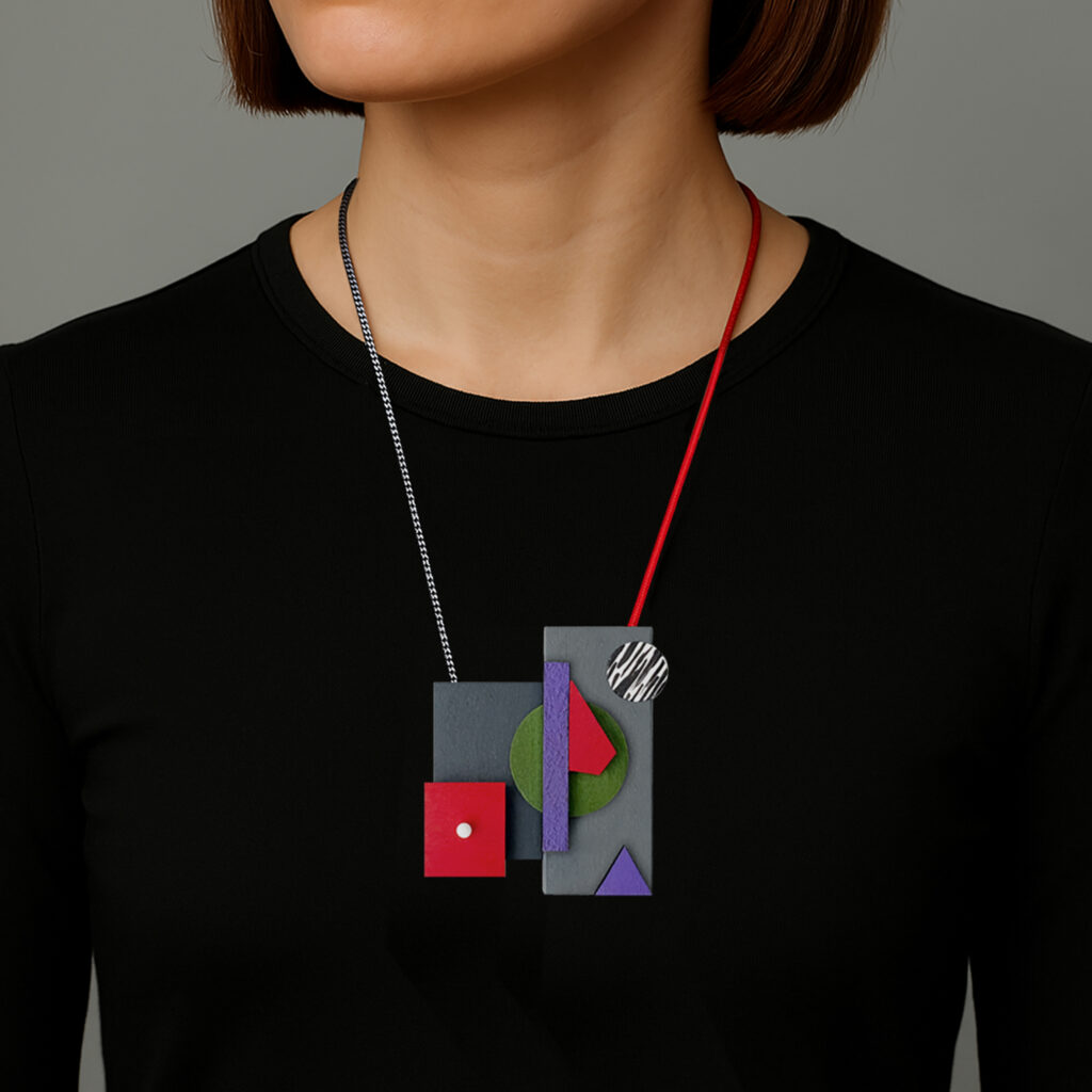 Red, purple and green geometric wooden necklace worn with a black top