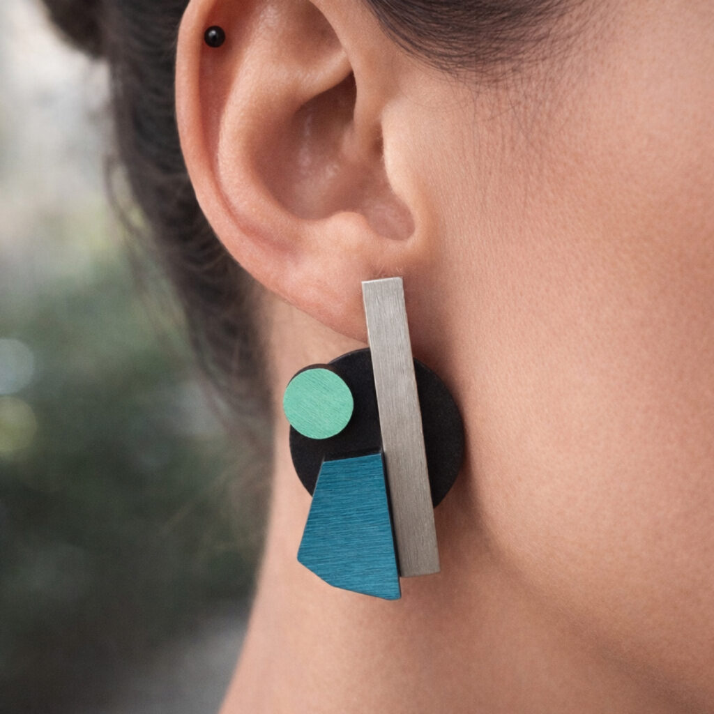 Turquoise and mint Bauhaus earrings worn on ear – second design