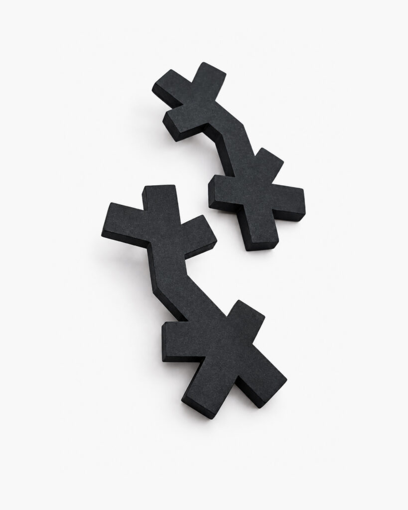 Pair of black abstract wooden dangle earrings with cross-shaped elements