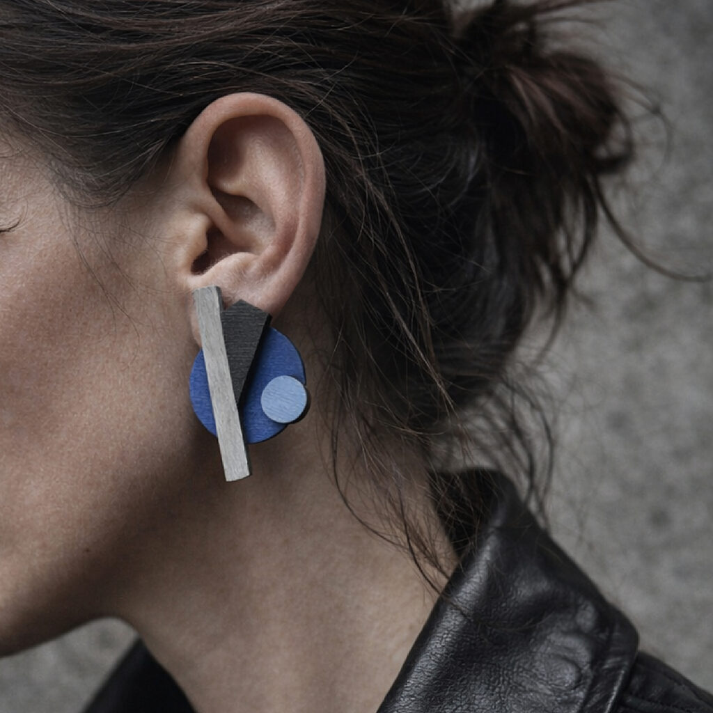 Blue black and grey abstract geometric statement earring worn on ear