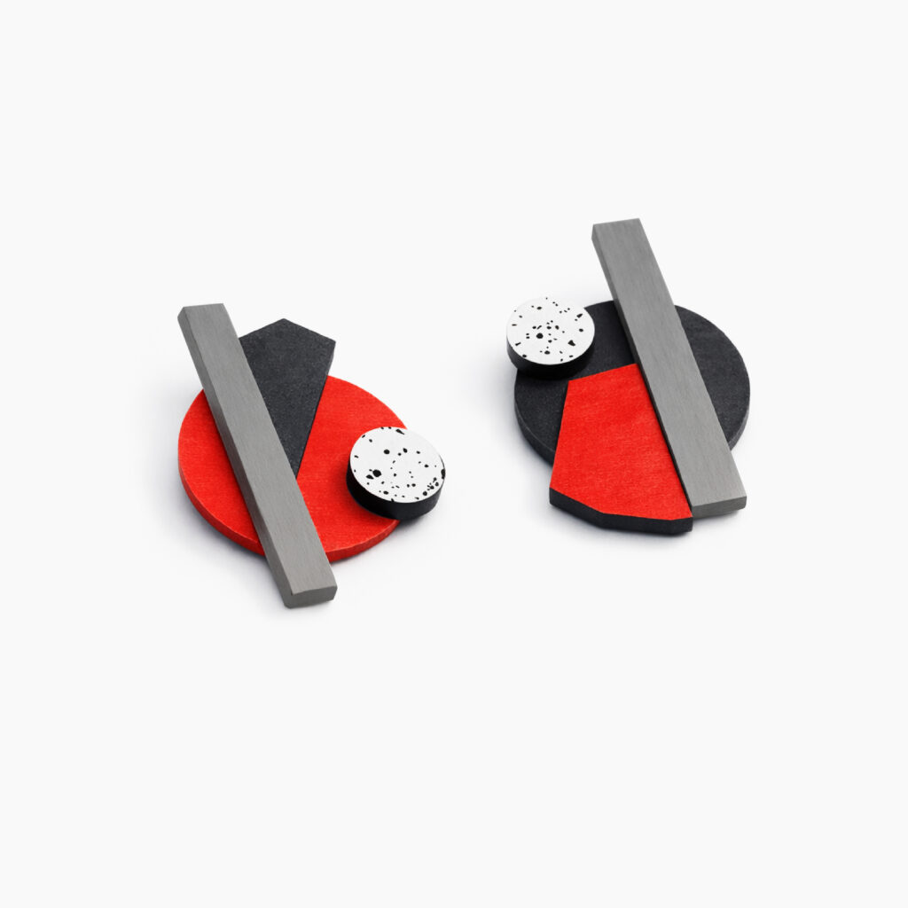 Pair of mismatched geometric earrings with layered hand-painted wooden shapes