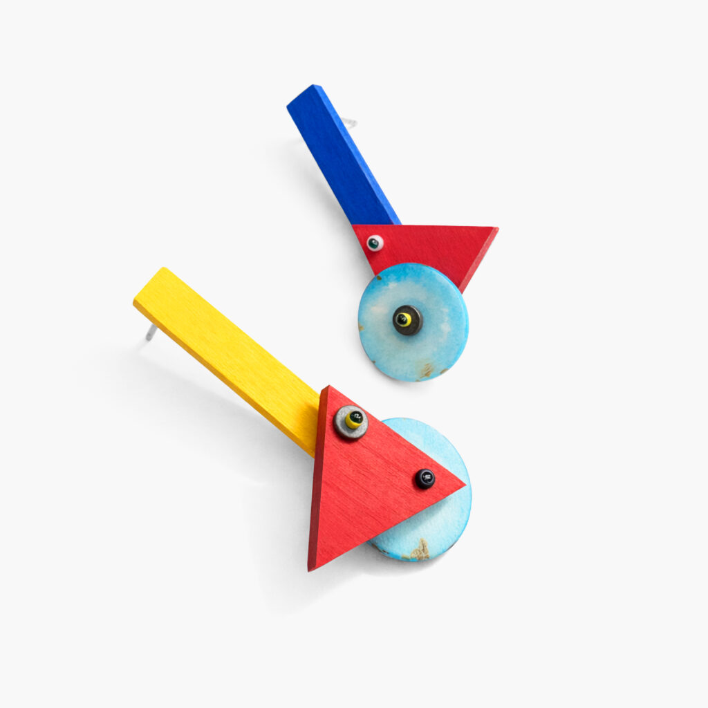 Asymmetrical geometric wooden earrings with red yellow and blue details
