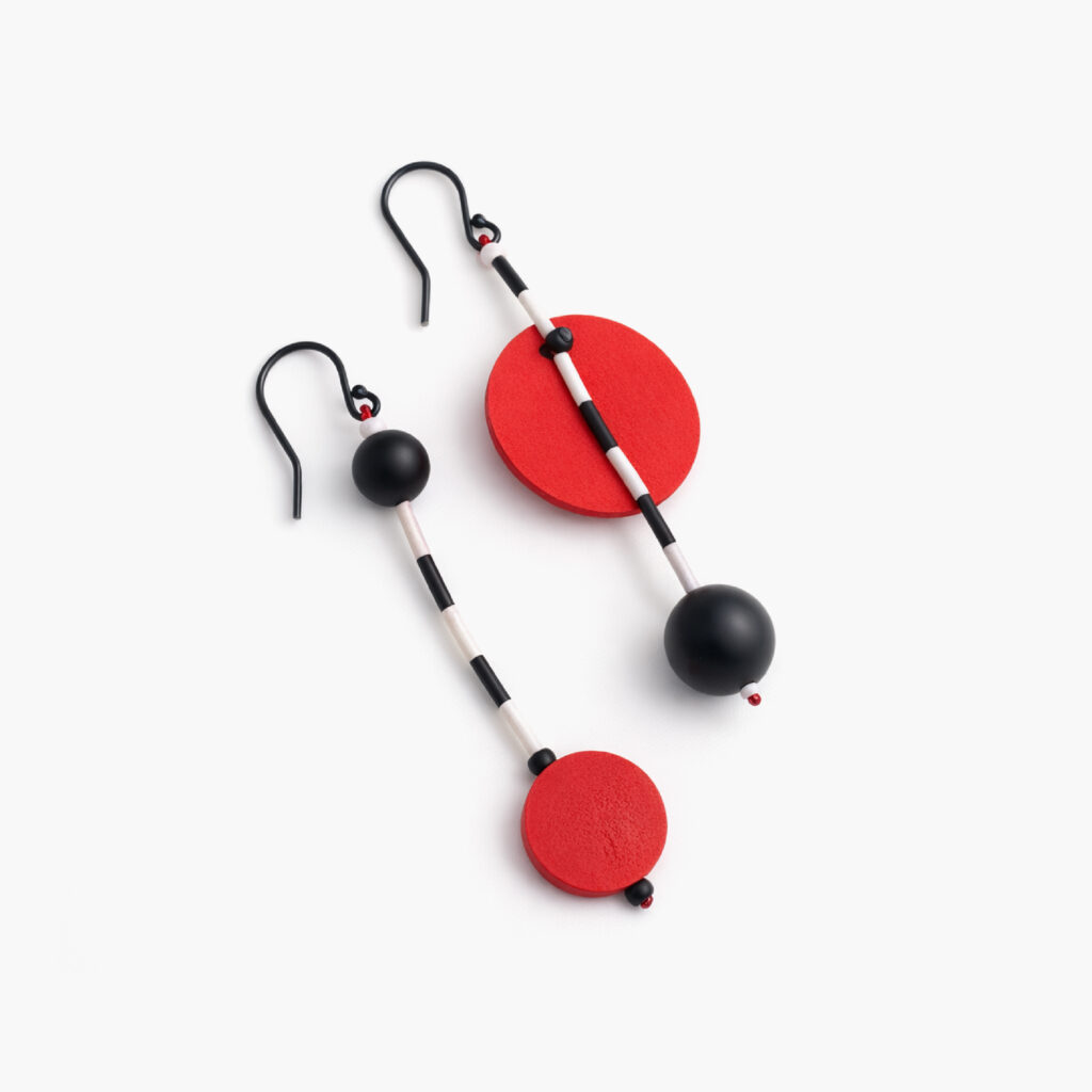 Pair of red and black mismatched wooden earrings with sterling silver hooks