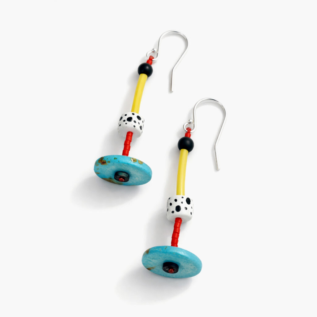 Colorful turquoise and yellow statement earrings with sterling silver hooks on white background