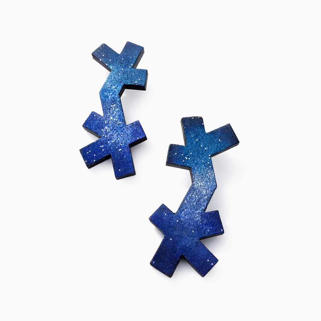Asymmetrical blue wooden earrings with overlapping cross-shaped elements
