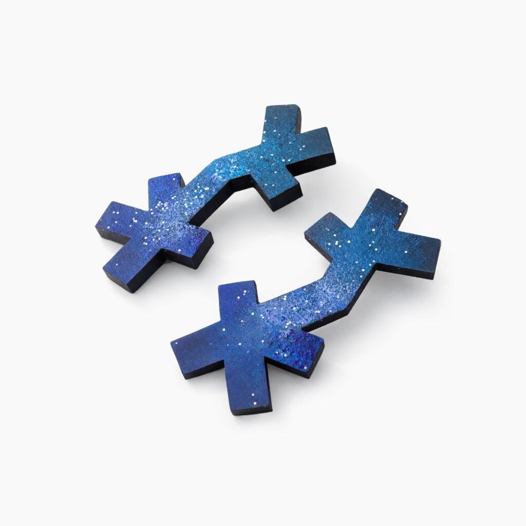 Pair of blue geometric statement earrings with speckled turquoise and cobalt finishes
