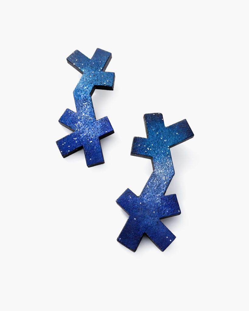 Asymmetrical blue wooden earrings with overlapping cross-shaped elements