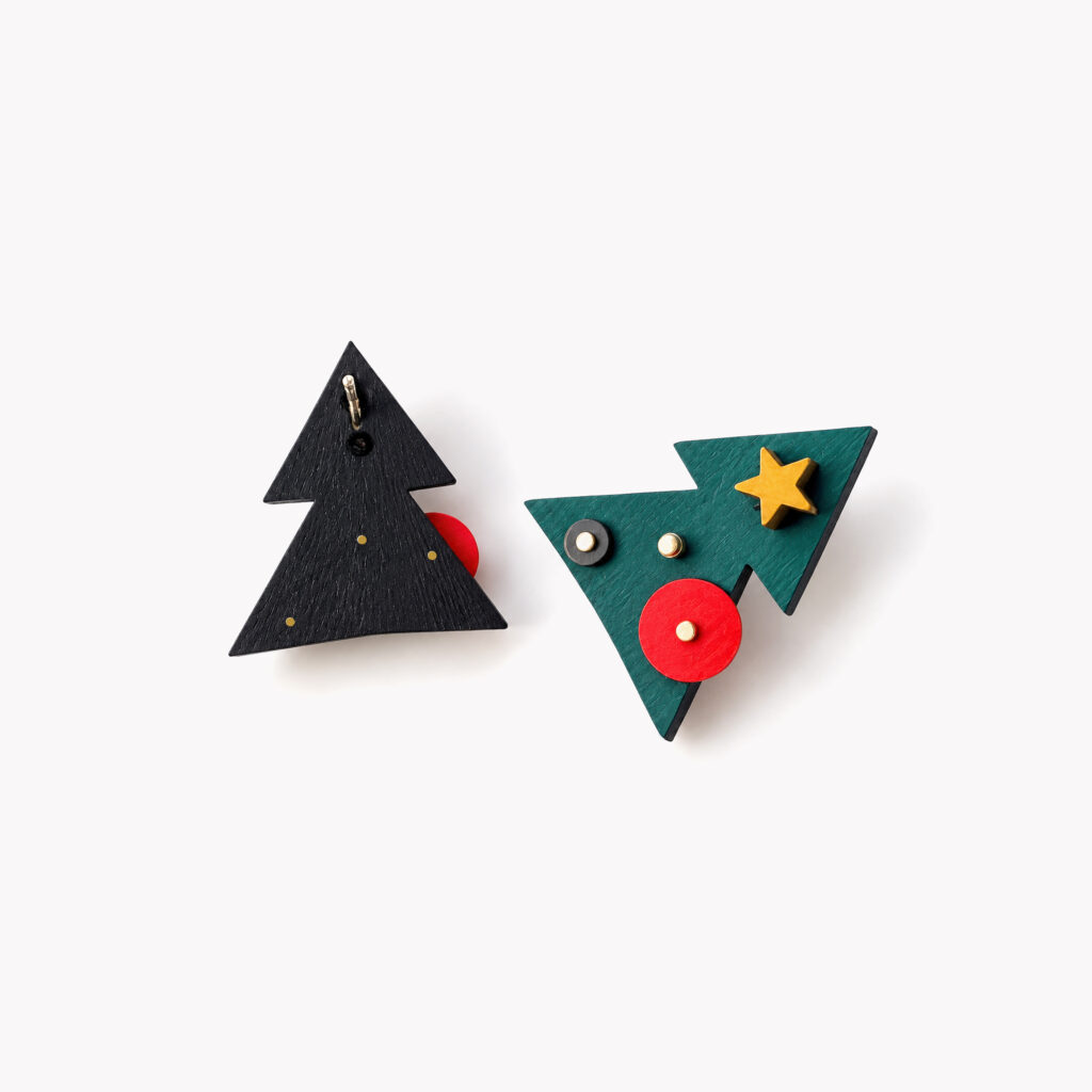 Front and back view of handmade wooden Christmas tree earrings