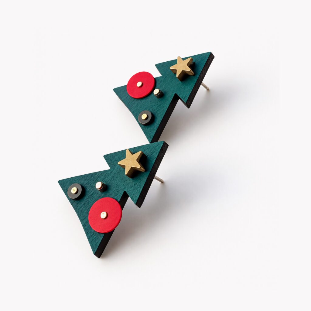 Hand-painted wooden Christmas tree earrings with geometric shapes – angled view