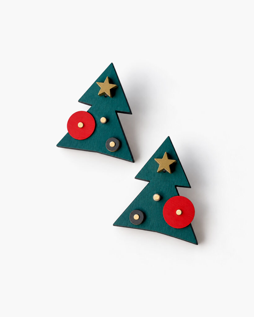 Geometric Christmas tree stud earrings with colorful decorations on white background