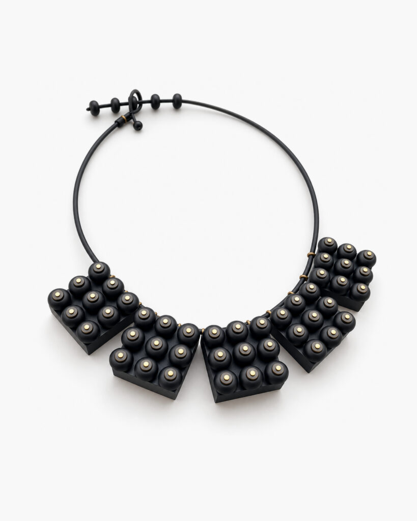 Black industrial statement necklace with geometric wooden elements and black onyx beads