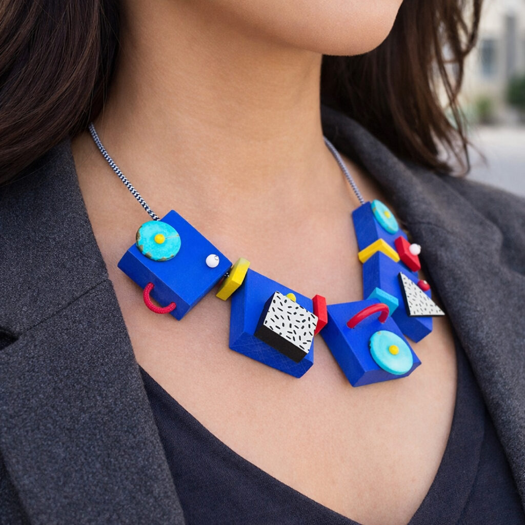 blue wooden abstract necklace worn with a dark blazer