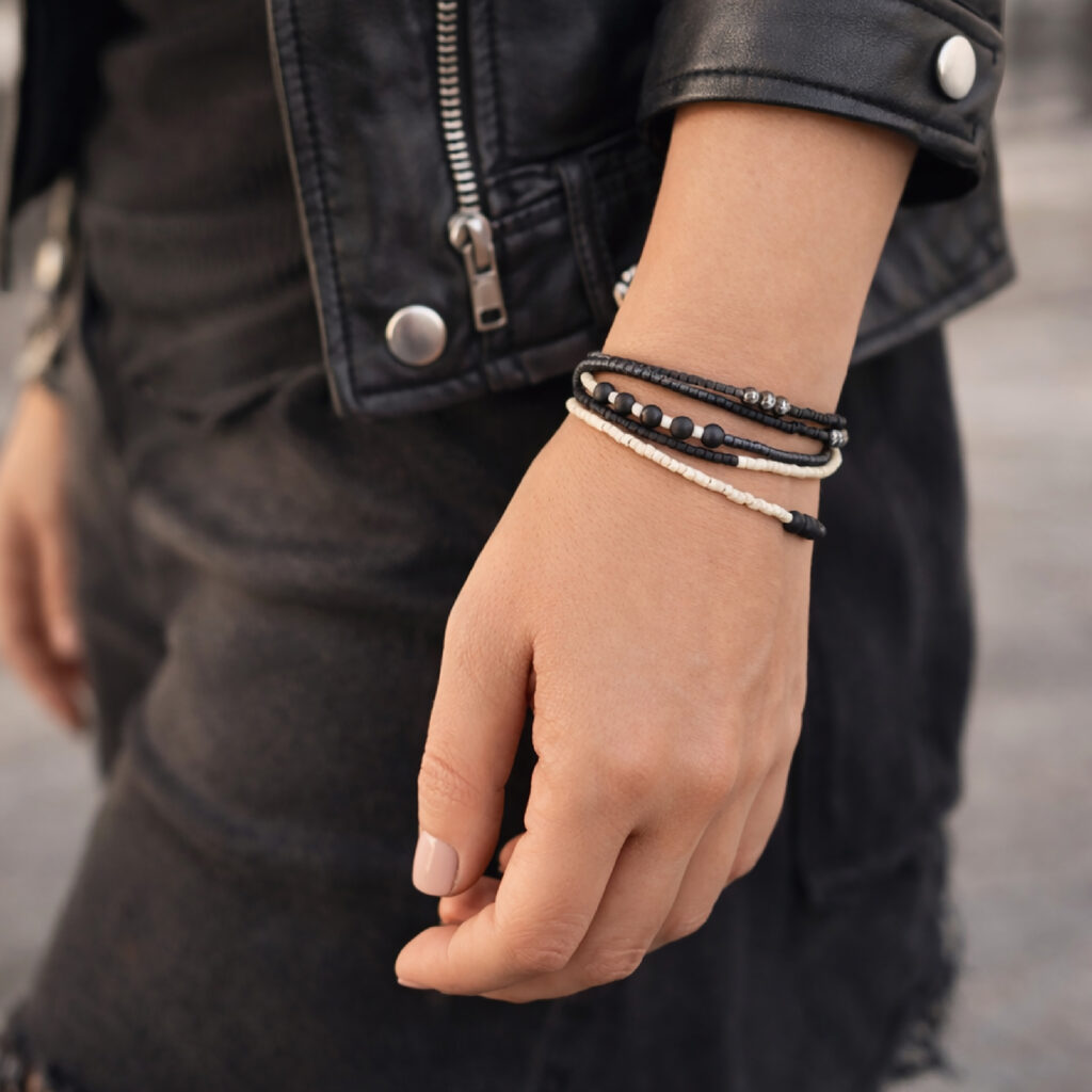 Black and white beaded necklace styled as a wrap bracelet