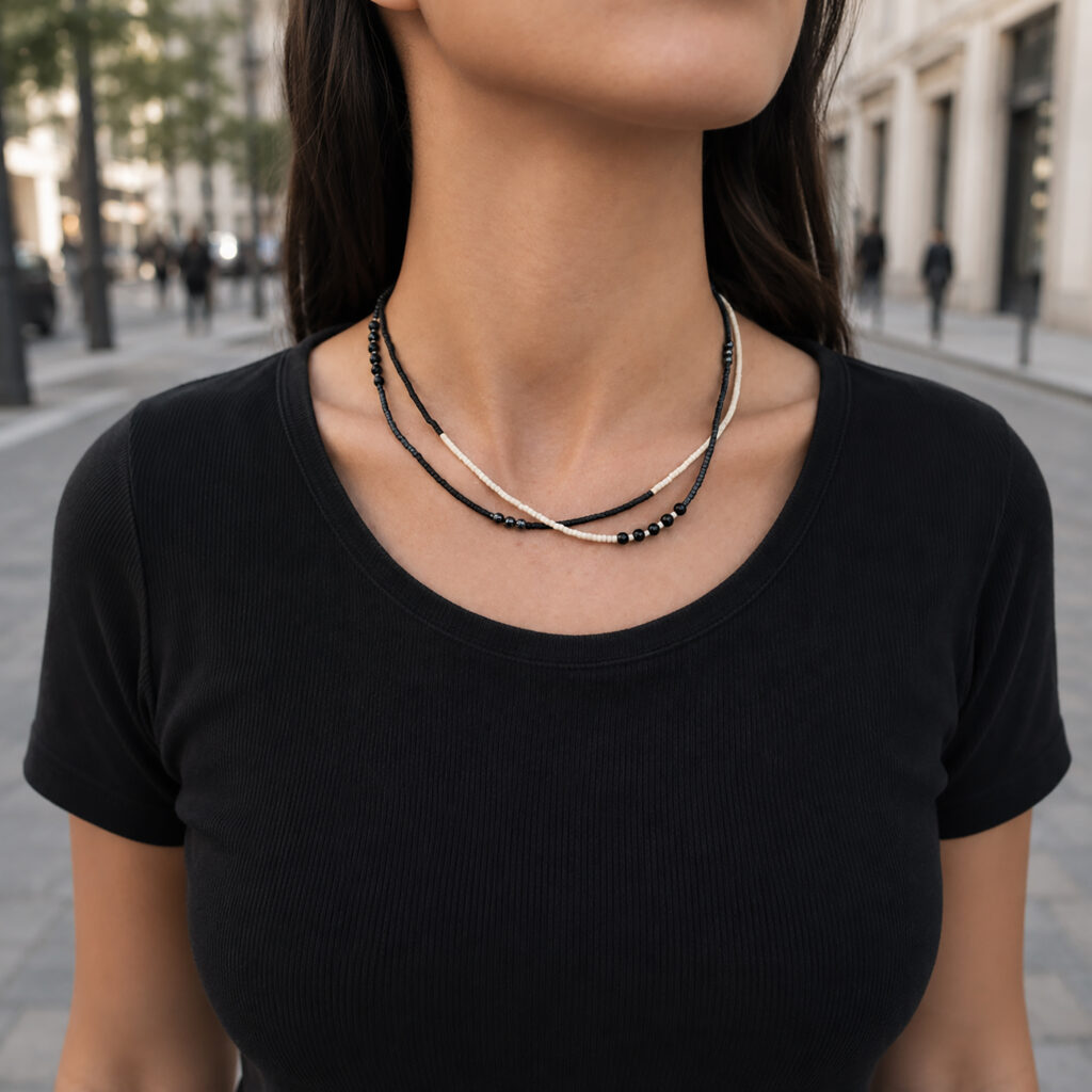 Black and white layered beaded necklace worn short